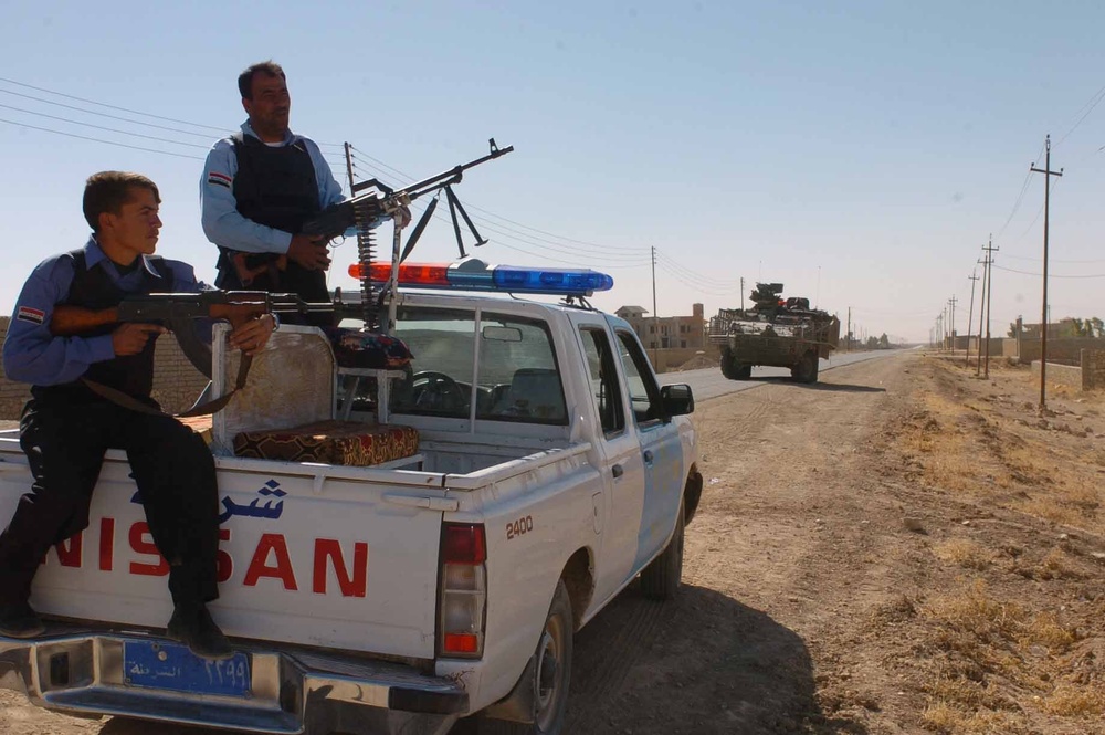 Iraqi police guard a checkpoint in Tal Afar