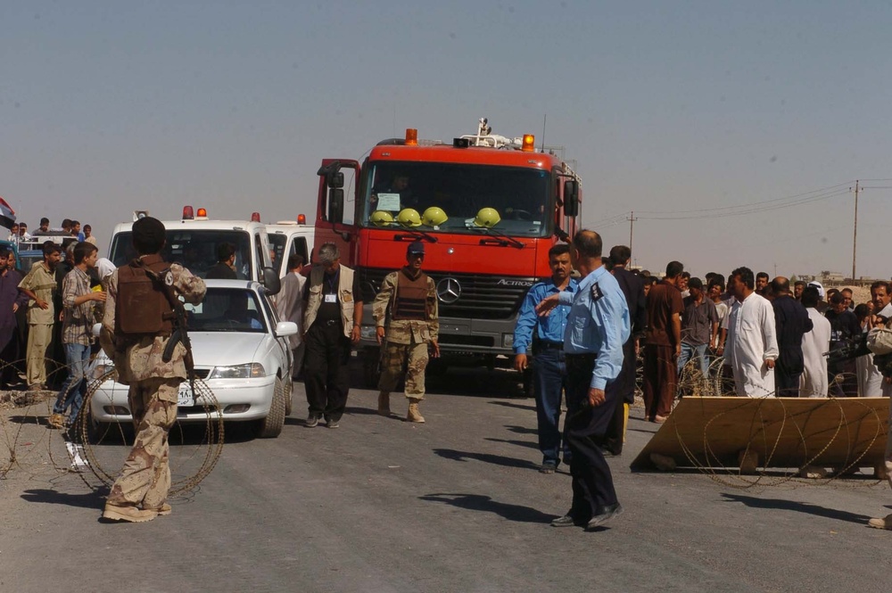 Emergency vehicles enter the city of Tal Afar