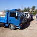 Soldiers Deliver Garbage Trucks to Al Mansour