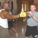 Sgt. Jordan M. Lenhoff strikes Billy Blanks hand