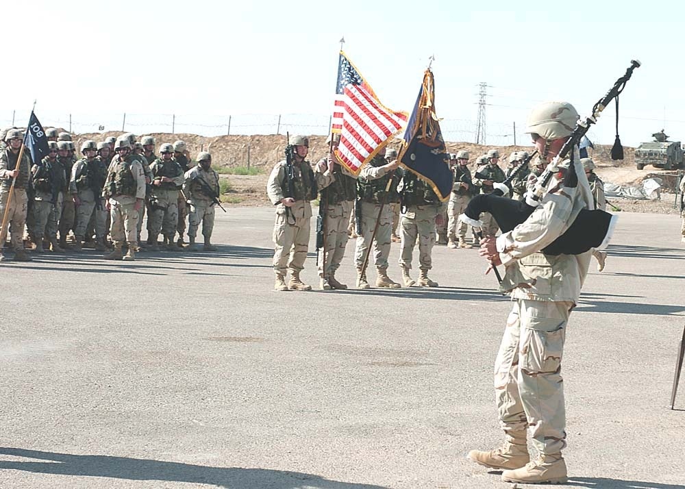 Tate playing the bagpipes during a Patriot Day ceremony