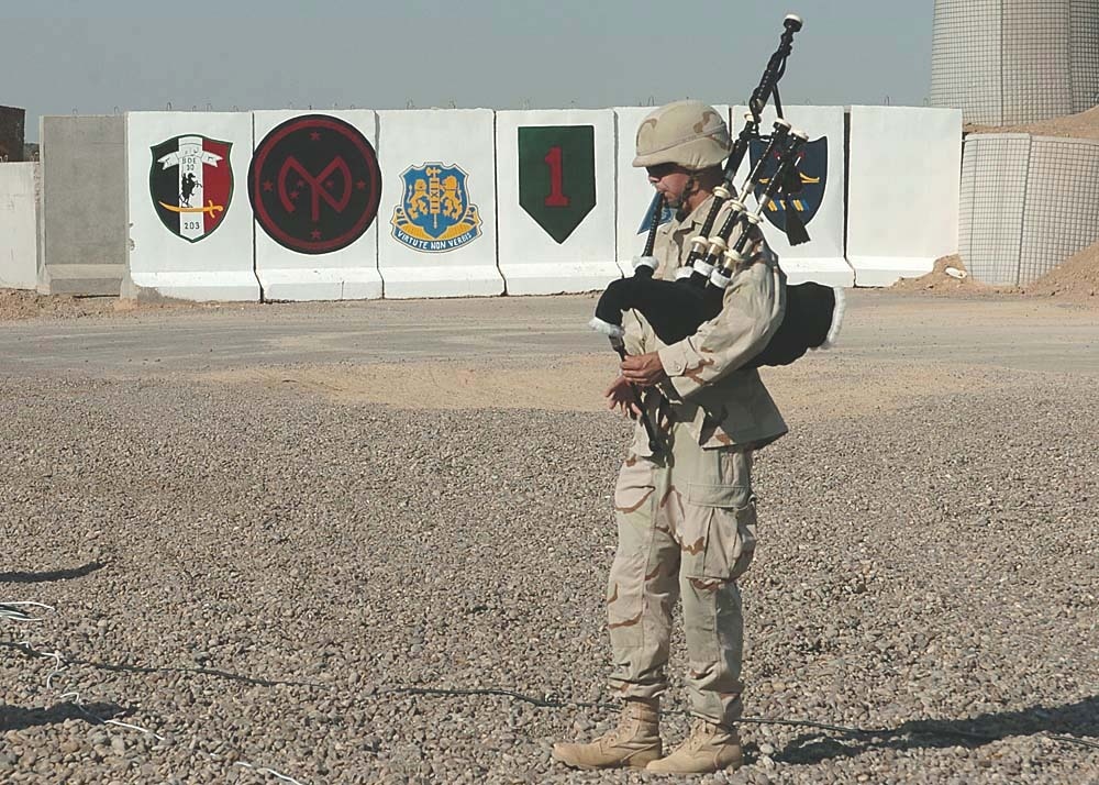 Tate playing the bagpipes during a Patriot Day ceremony