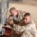 216th Engineer work on the back of a humvee