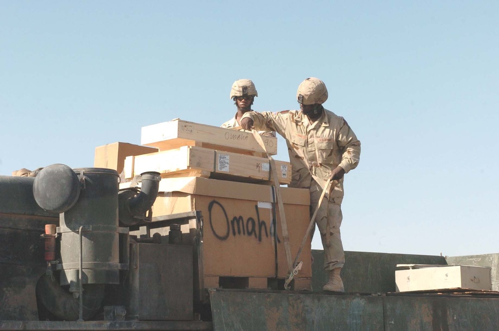 1-18th Infantry soldiers strap down a load of cargo