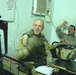 Staff Sgt. Cook talks to a civilian police adviser