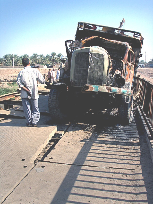 A truck destroyed by an insurgent car bomb