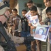 Sgt. Abner hands out coloring books