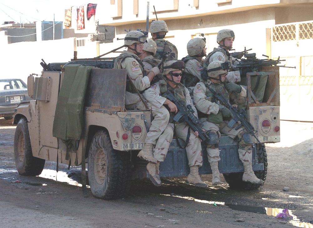 HMMWV rolls slowly through a Hawija road