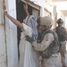 Staff Sgt. Jesse Wyant searches an Iraqi man