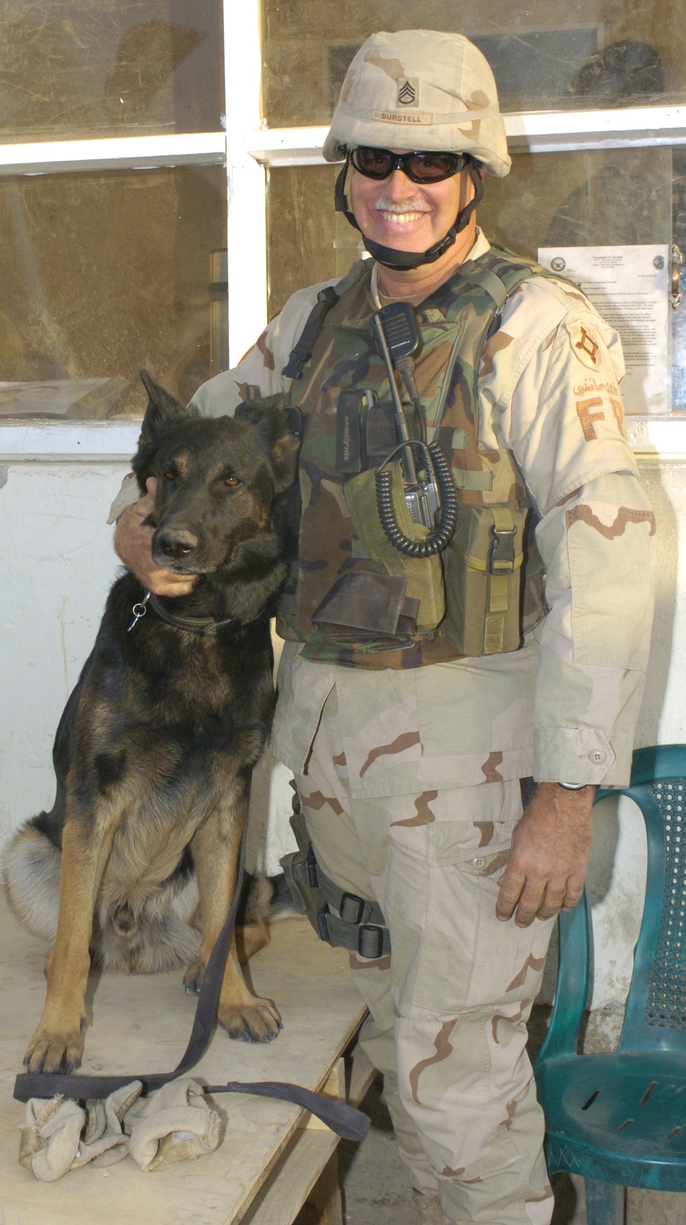 Staff Sgt. Brett Burstell pets his dog Astor