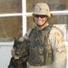 Staff Sgt. Brett Burstell pets his dog Astor