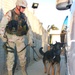 Staff Sergeant Burstell and Astor check a vehicle