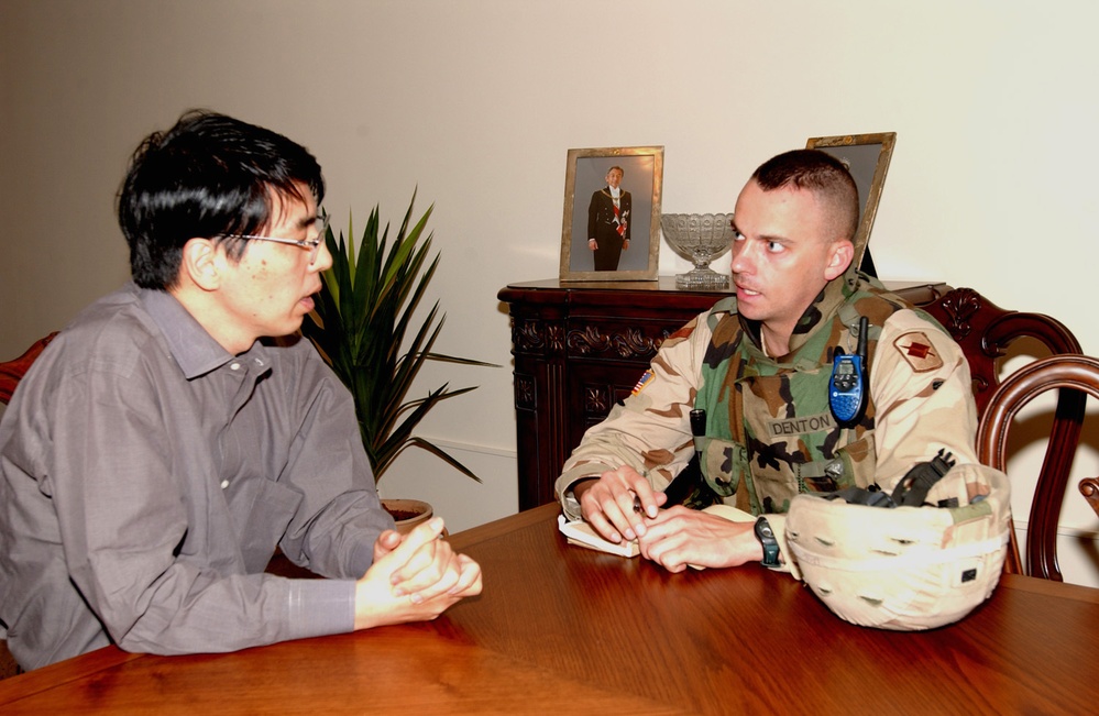 1st Lt. Ronnie Denton meets with a representative at the Japanes