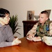 1st Lt. Ronnie Denton meets with a representative at the Japanes