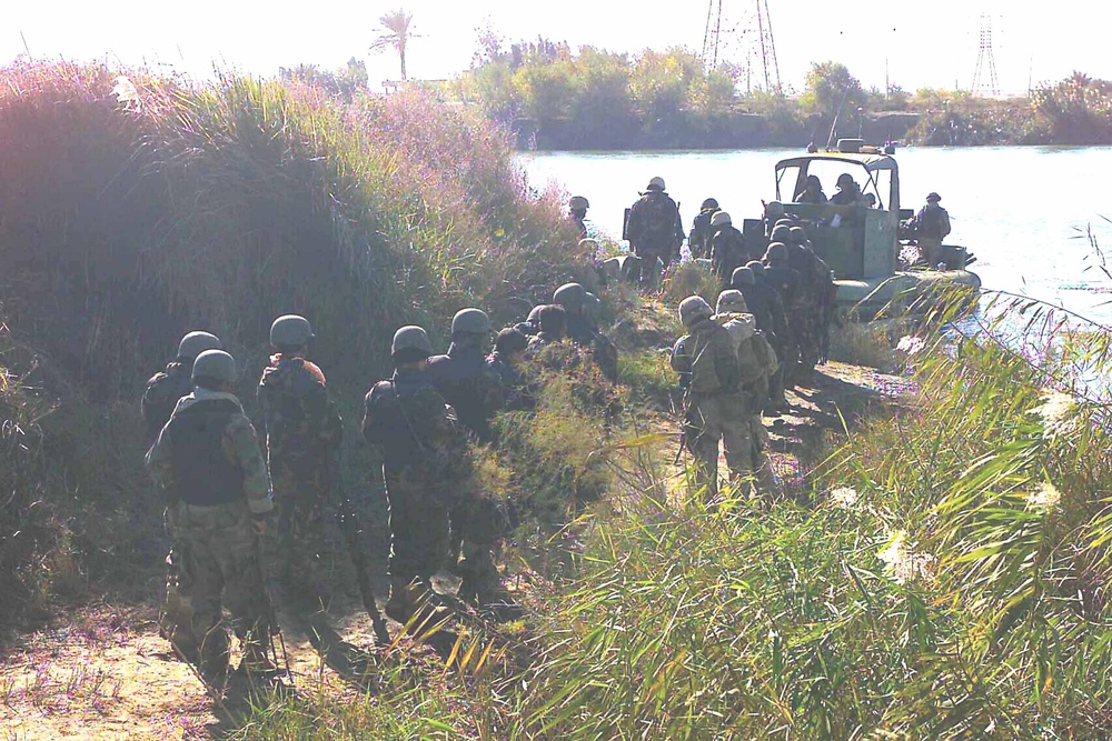 Soldiers load into boats