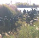 Soldiers load into boats