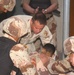 Sgt Appel treats an injured Iraqi National Guardsman