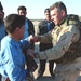 Sgt. Dan MacDonald  instructs an Iraqi police patrolman