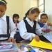 Children sort through school supplies