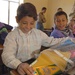 Wadea Ali Hussein looks excitingly through school supplies