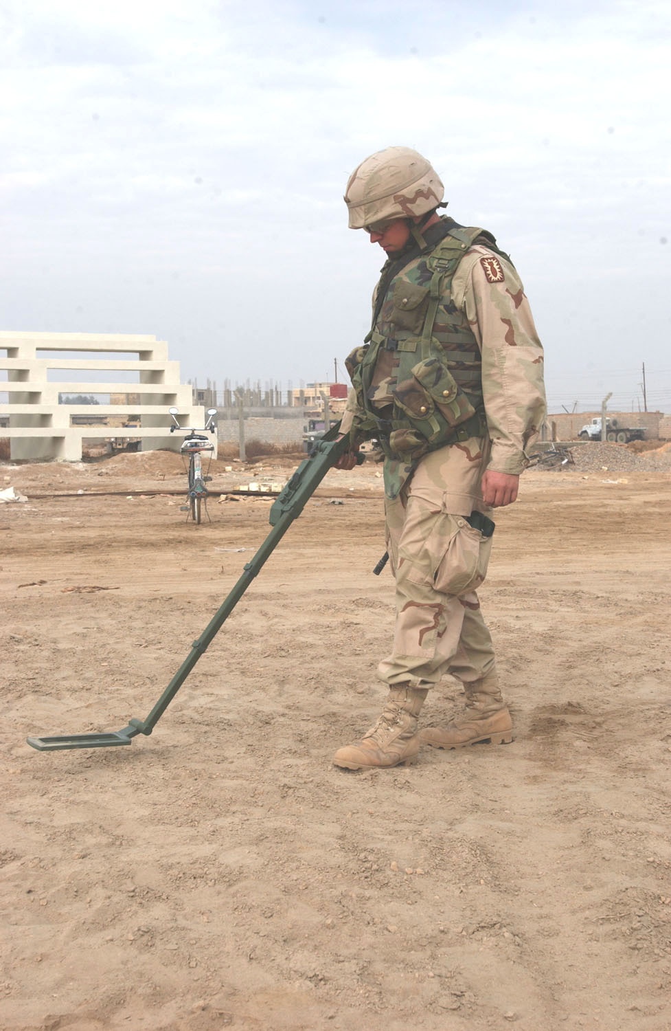 Pfc Todd Rampmeyer sweeps a soccer field