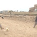 Capt. Coley Tyler plays soccer with children
