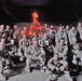 Soldiers pose in front of the battalions motor pool Xmas tree