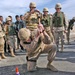 Maj. Gen. Natynczyk swings a mallet into a golden spike