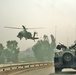 Soldiers receive an escort from AH-64 (Apache) helicopters
