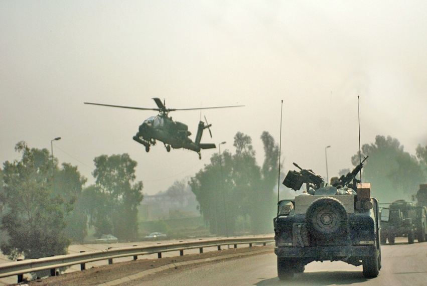 Soldiers receive an escort from AH-64 (Apache) helicopters