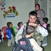 Spc. Robert Espinosa plays with one of the children