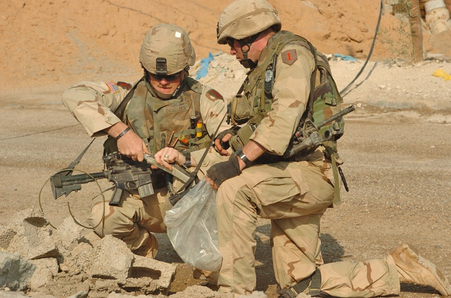 Soldiers prepare to detonate an anti-tank mine