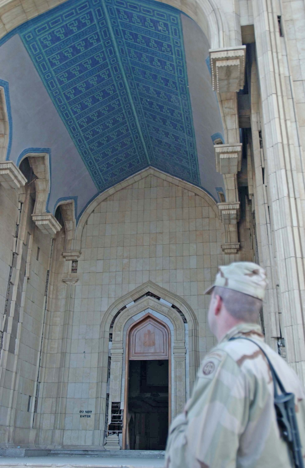 A medic looks up at the tiled ceiling of the entrance