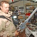 Pfc. Brian Springer examines an Iraqi sword