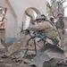 Explosive ordnance personnel sift through the wreckage