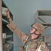 Sgt. Scaggs puts donated medical supplies onto a shelf