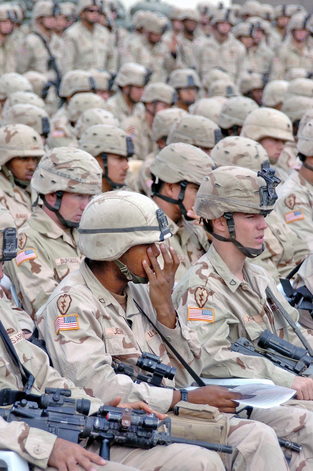 Pfc. Jenkins wipes his eye during Spc. Mahlenbrock memorial cere