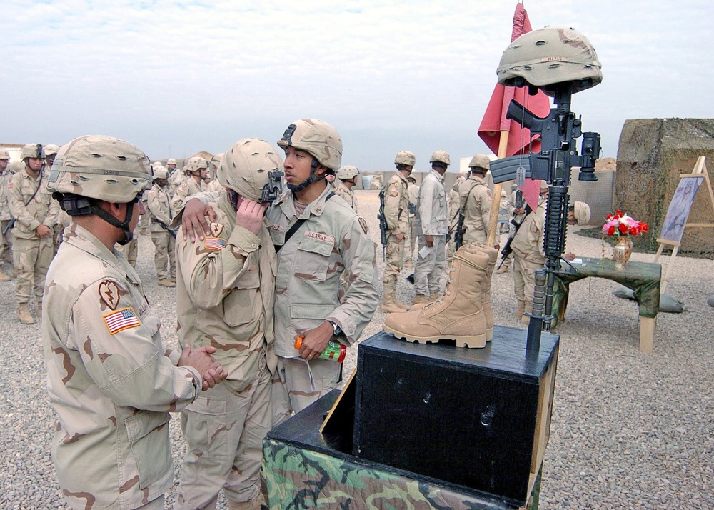 Sgt. Moises Rameriz consoles Sgt. Stephen Fritz