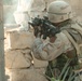 PFC David L. Gilette returns fire on insurgents