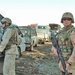 Soldiers lead their convoy through stopped traffic