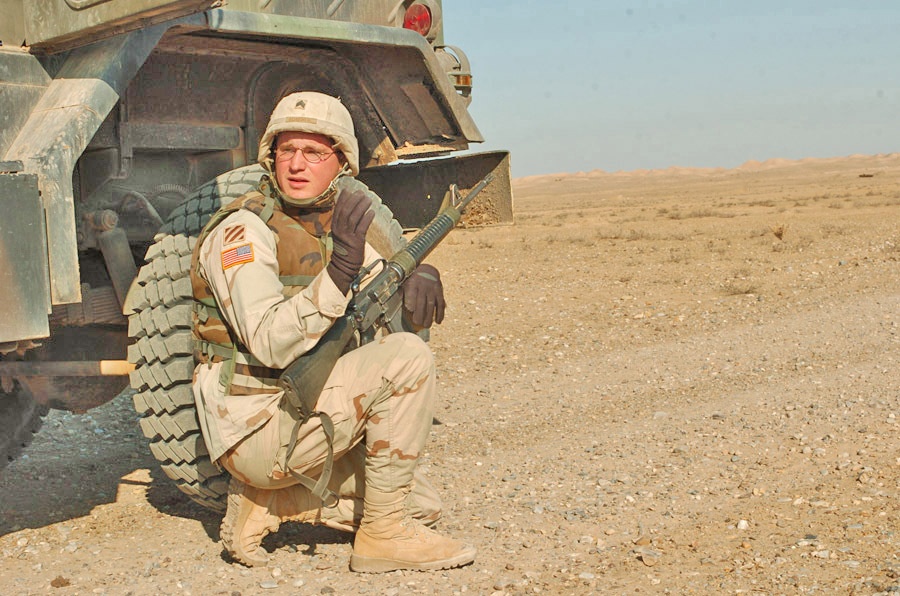 SGT Schneweis dismounts to pull security during a convoy