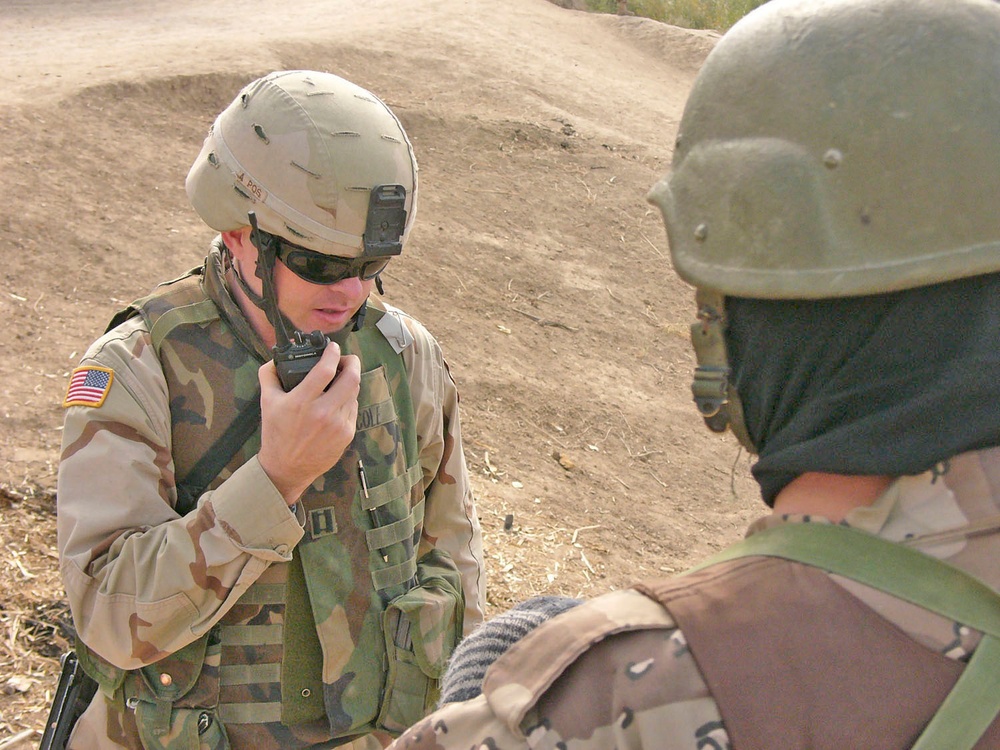 Capt. Mike Cole talks over the radio to a sergeant