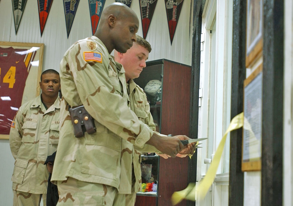 Lt. Col. Lewis cuts the ceremonial yellow ribbon