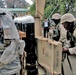Soldiers unload supplies at a hospital