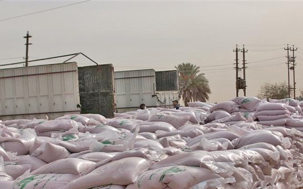 Council members distribute grain seed to local farmers