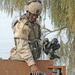Spc. Vester Smith  lowers a pair of soccer shoes to some wanting