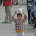 A smile stretches across the face of an Iraqi child