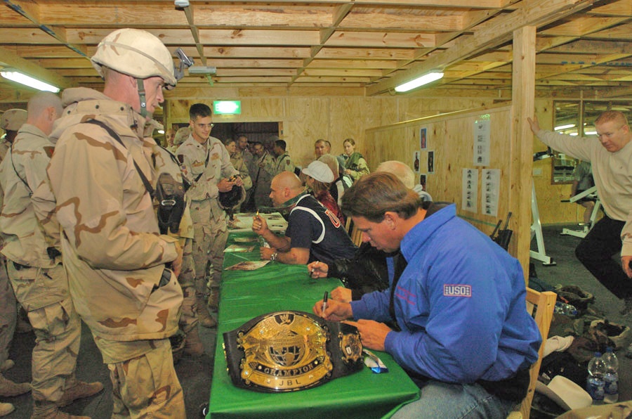 WWE stars sign autographs for troops