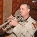 Staff Sgt. Ken Harvey warms up on his trumpet