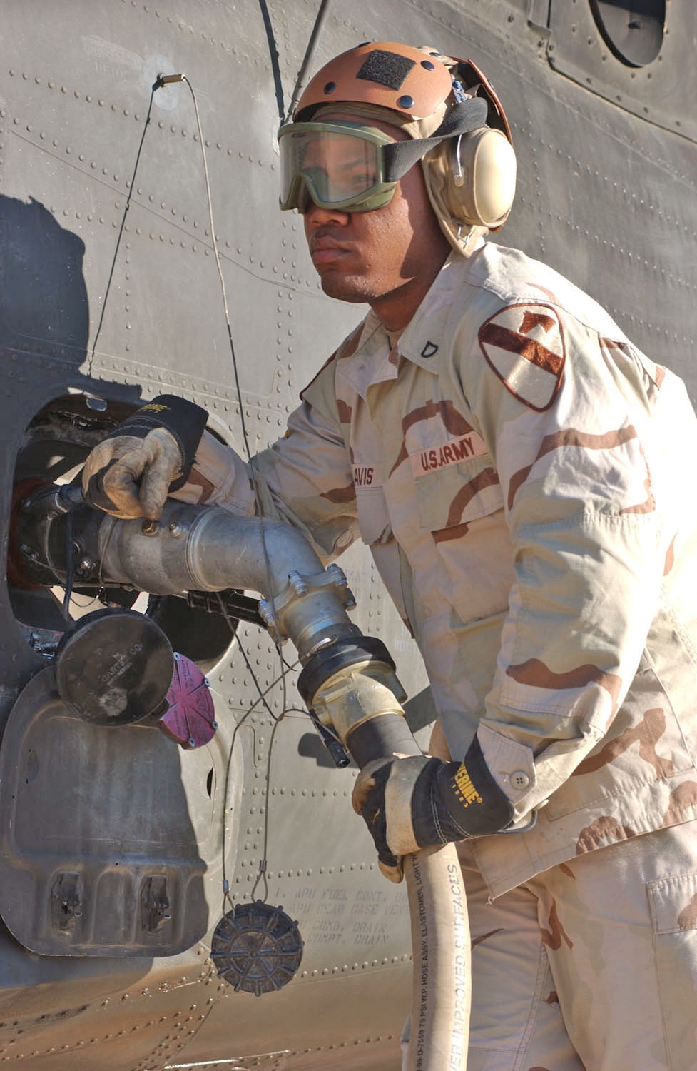 Pfc Rasheen Davis tops off a Black Hawk Helicopter